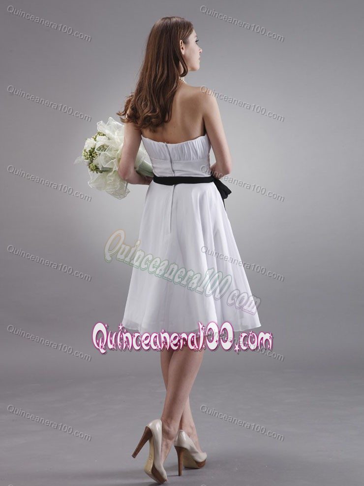 White Knee-length Chiffon Dama Dress with Ruches and Black Sash